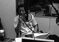 Oliver Augst behind microphone